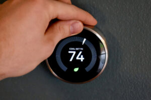A circular smart thermostat set to energy-saving mode